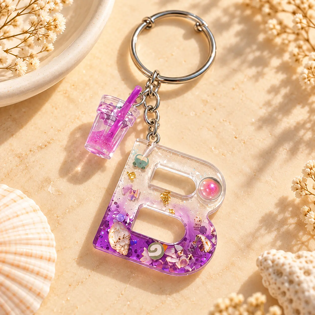 Purple resin letter B keyring with a milkshake cup charm